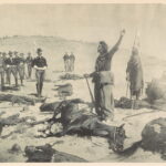 Historical black and white photo of the mass grave at Wounded Knee, 1891, showing the tragic aftermath of the massacre.